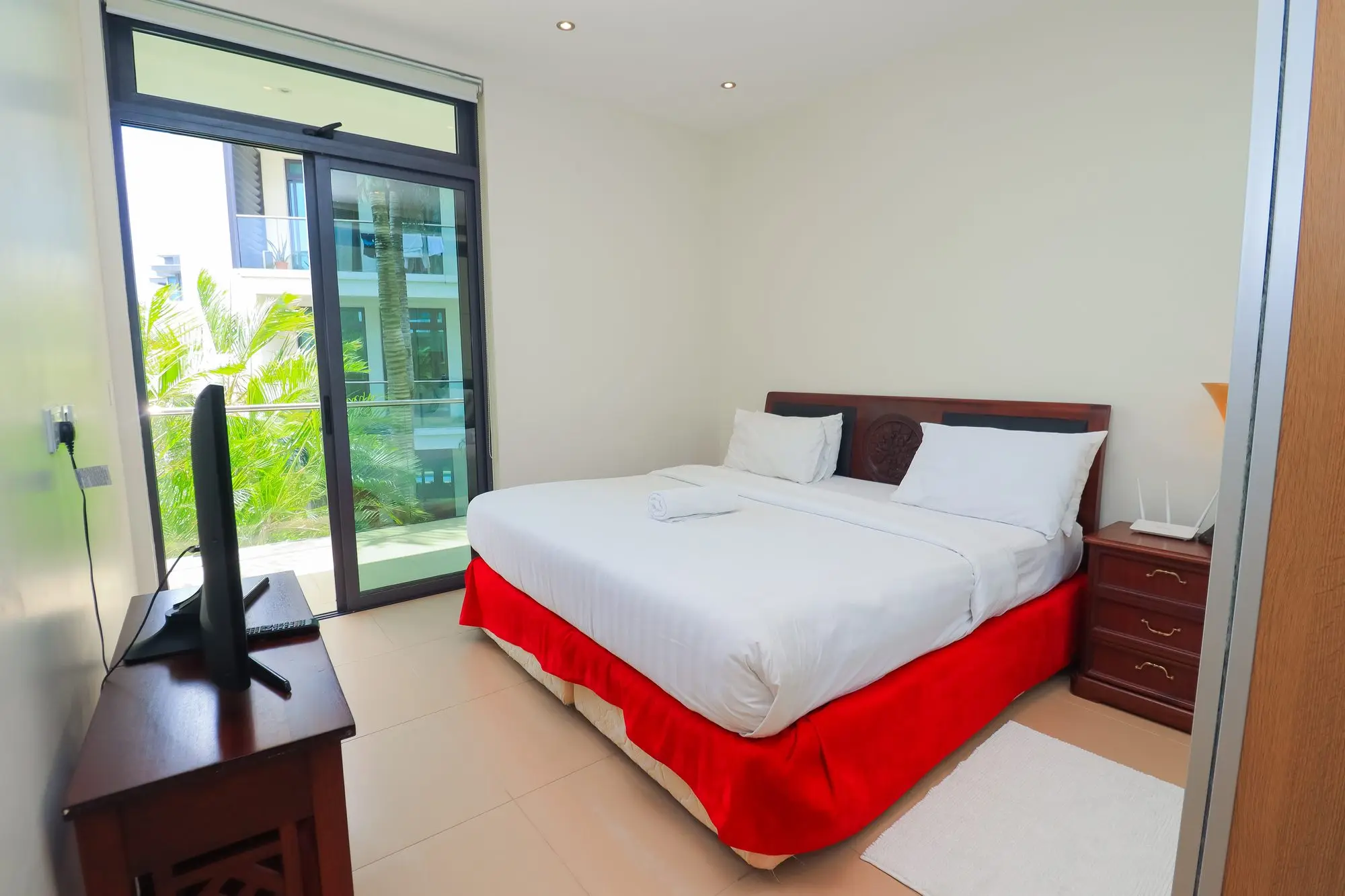Bright second bedroom with private balcony access at Nyali Marina Stays, Nyali Mombasa