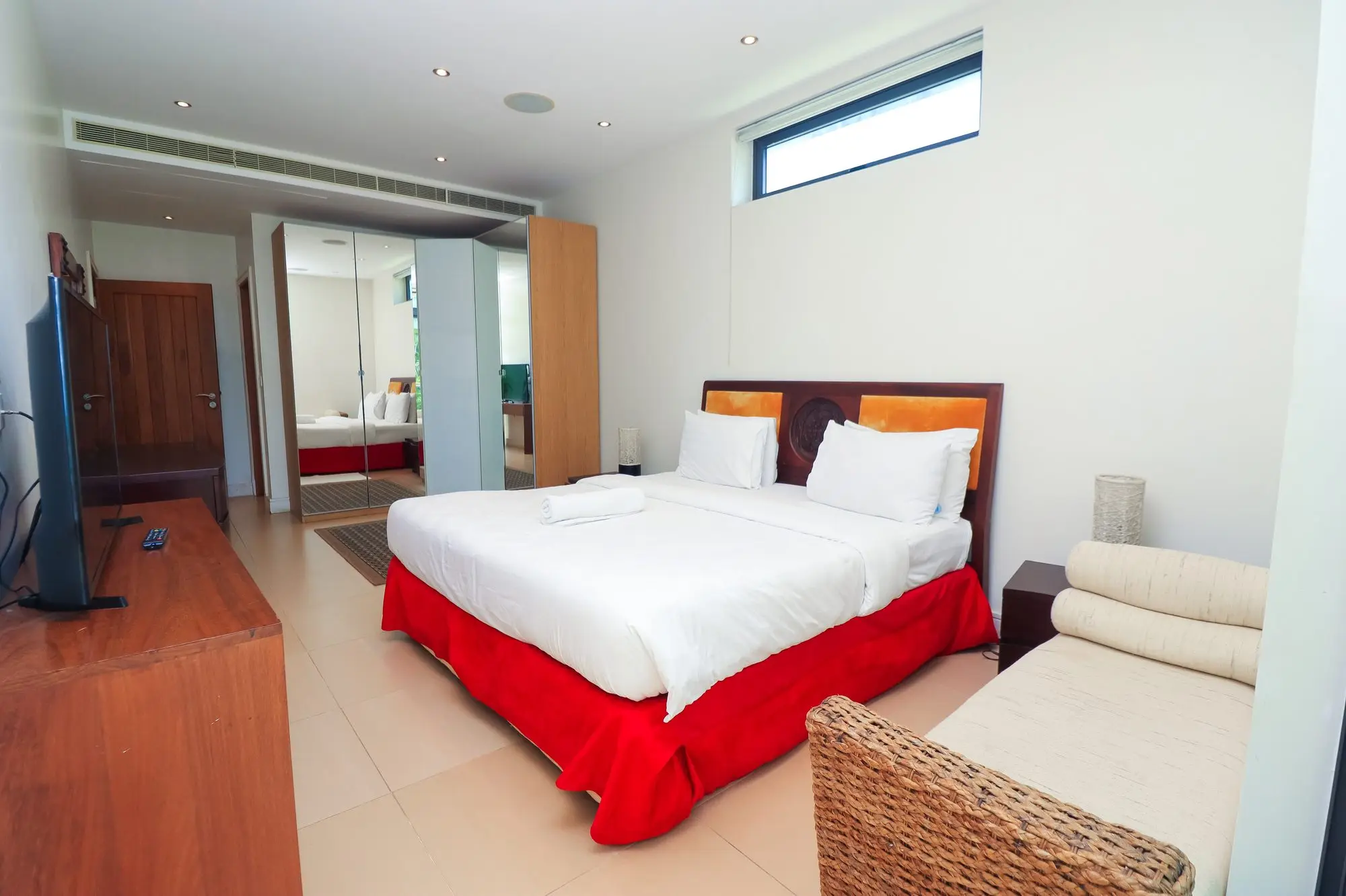 Master bedroom with en-suite and mirrored wardrobes at Nyali Marina Stays, Nyali Mombasa