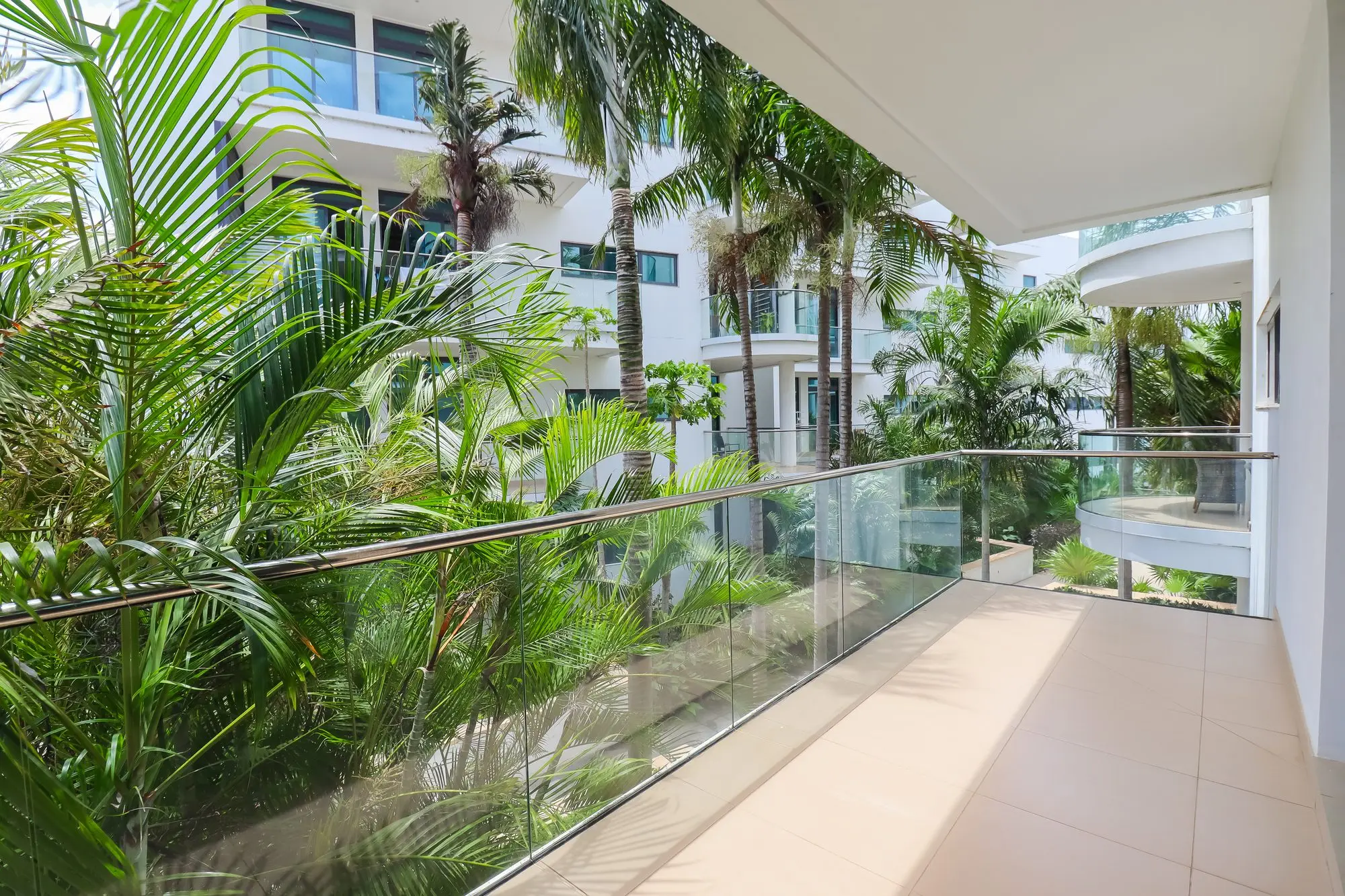 Private balcony overlooking lush tropical palm gardens at Nyali Marina Stays, Mombasa